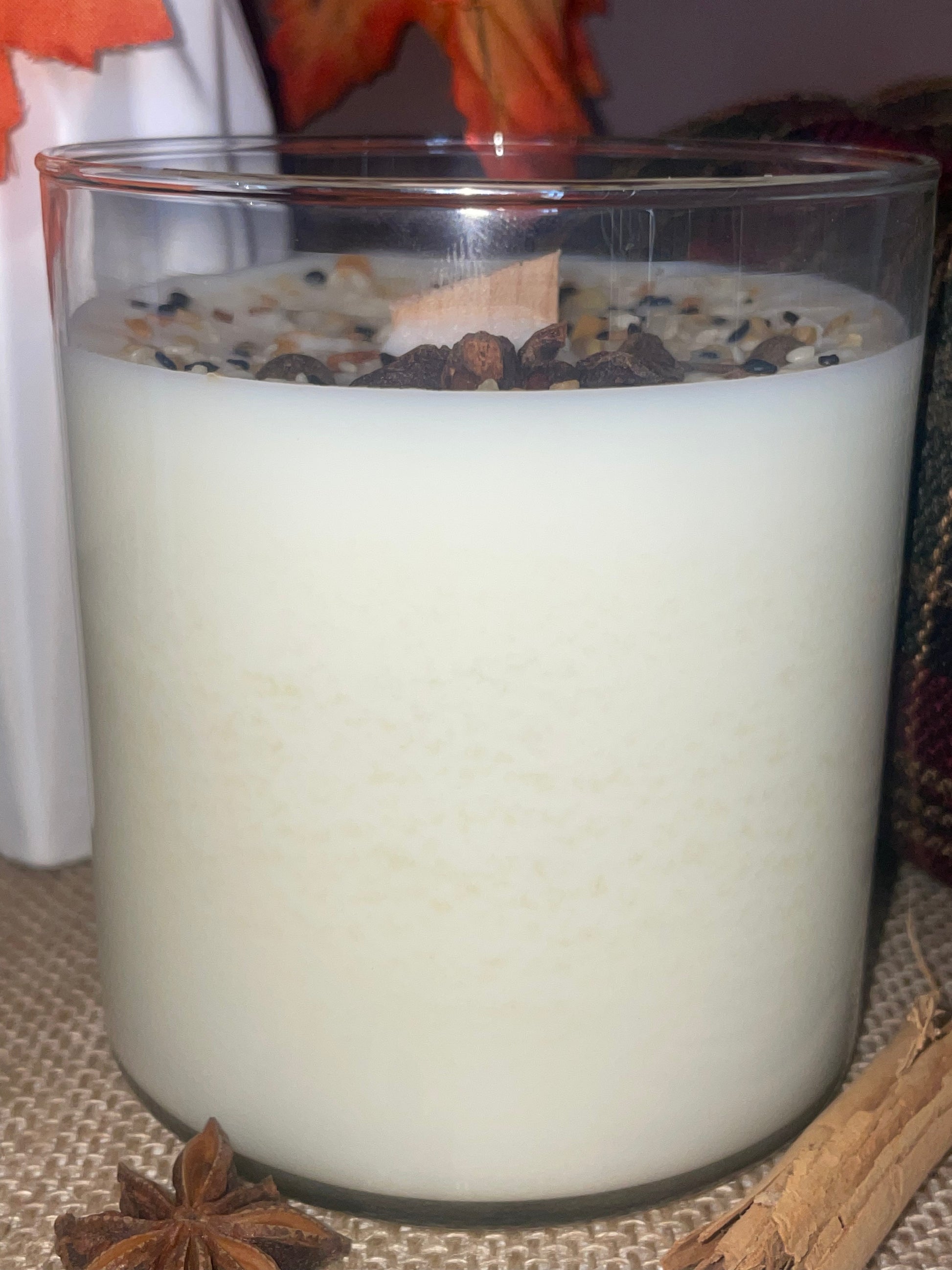 Creamy soy wax candle with star anise and spices.